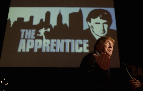 FILE - Donald Trump, seeking contestants for "The Apprentice" television show, is interviewed at Universal Studios Hollywood Friday, July 9, 2004, in the Universal City section of Los Angeles. (AP Photo/Ric Francis, File)