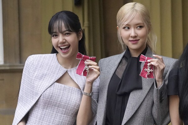Lisa (Lalisa Manoban), left, and Rose (Roseanne Park) from the K-Pop band Blackpink pose with their Honorary MBEs, Members of the Order of the British Empire, awarded to them in recognition of the band's role as COP26 advocates for the COP26 Summit in Glasgow 2021, in London, on Nov. 22, 2023. (Victoria Jones/Pool Photo via AP, File)