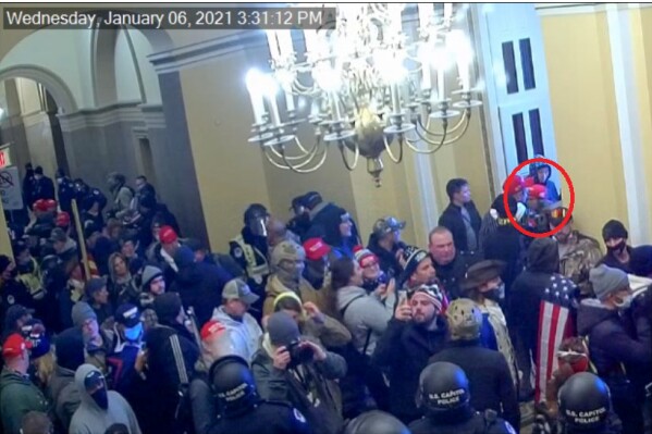 This image from video from the Justice Department in the statement of facts supporting an arrest warrant, and annotated by the source, shows Kennedy Lindsey entering the U.S. Capitol on Jan. 6, 2021, in Washington. (Justice Department via AP)