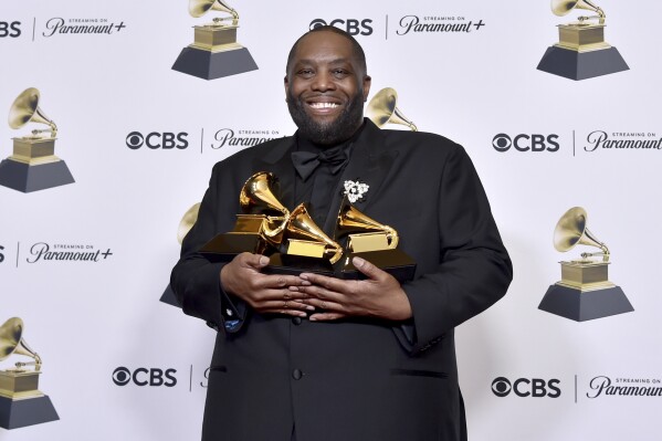 FILE - Killer Mike poses in the press room with the awards for best rap performance and best rap song for "Scientists & Engineers," and best rap album for "Michael" during the 66th annual Grammy Awards on Sunday, Feb. 4, 2024, in Los Angeles. Killer Mike is expected to avoid charges over a physical altercation that led to his arrest at the Grammys earlier this year after the rapper recently completed community service. (Photo by Richard Shotwell/Invision/AP)