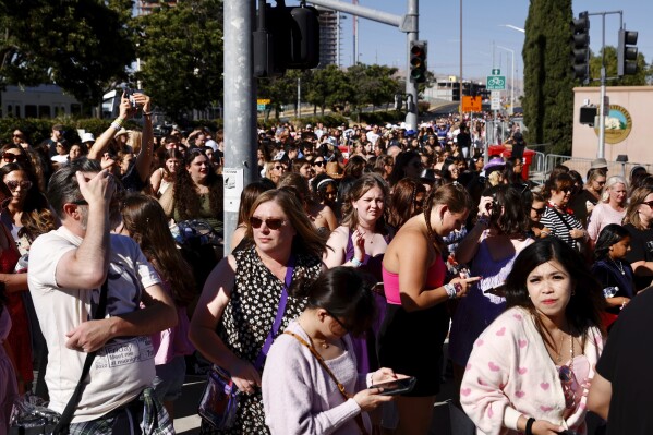 FILE - Fans wait to go through security before Taylor Swift performs at Levi's Stadium in Santa Clara, Calif. on July 28, 2023. The 2022 fiasco after there were a myriad of problems with fans trying to buy tickets for Swift's massive "Eras" tour shone a light on cracks in the ticketing system. (Jessica Christian/San Francisco Chronicle via AP, File)