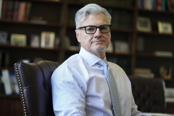 FILE - Judge Juan M. Merchan poses in his chambers in New York, March 14, 2024. (AP Photo/Seth Wenig, File)