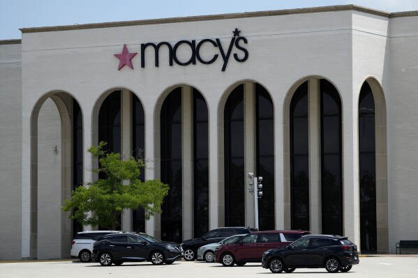 FILE - Cars are parked in front of a Macy's store at Hawthorn Mall in Vernon Hills, Ill., June 3, 2024. (AP Photo/Nam Y. Huh, File)