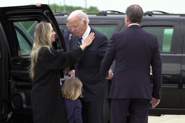 President Joe Biden talks with his son Hunter Biden, right, and wife Melissa Cohen Biden, and grandson Beau, as he arrives Delaware Air National Guard Base in New Castle, Del., Tuesday, June 11, 2024. (AP Photo/Manuel Balce Ceneta)