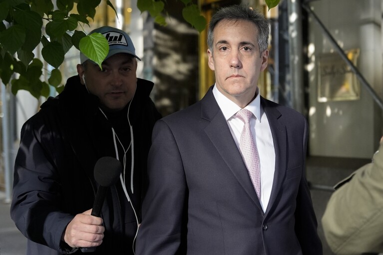 Michael Cohen leaves his apartment building on his way to Manhattan criminal court, Monday, May 13, 2024, in New York. (AP Photo/Julia Nikhinson)