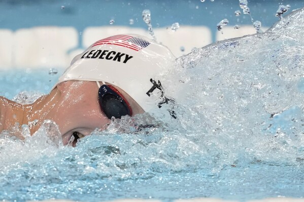 United States' Katie Ledecky competes in a women's 800-meter freestyle heat at the Summer Olympics in Nanterre, France, Friday, Aug. 2, 2024. (AP Photo/Ashley Landis)