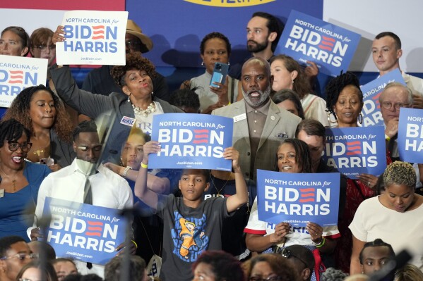 Supporters cheer as Vice President Kamala Harris speaks at a campaign event in Greensboro, N.C., Thursday, July 11, 2024. (AP Photo/Chuck Burton)