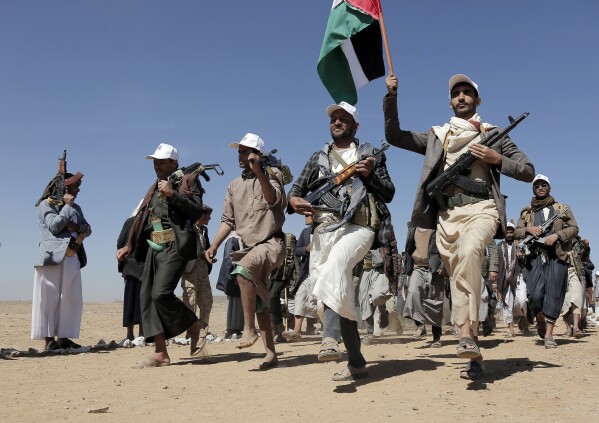 File - Houthi rebel fighters march during a rally of support for the Palestinians in the Gaza Strip and against the U.S. strikes on Yemen outside Sanaa on Jan. 22, 2024. (AP Photo, File)