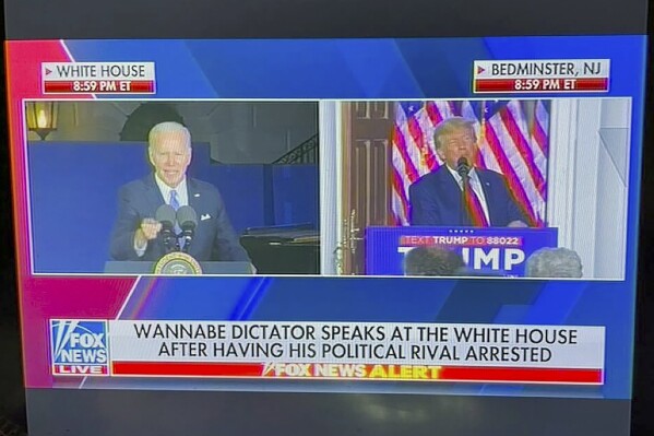 This image provided by Will Harris taken of a video shows a Fox News onscreen headline beneath a split-screen image of former President Donald Trump speaking to supporters live and President Joe Biden speaking earlier at the White House. The Fox News Channel chyron read, "Wannabe dictator speaks at the White House after having his political rival arrested." Fox said in a statement that "the chyron was taken down immediately and was addressed." (Will Harris via AP)