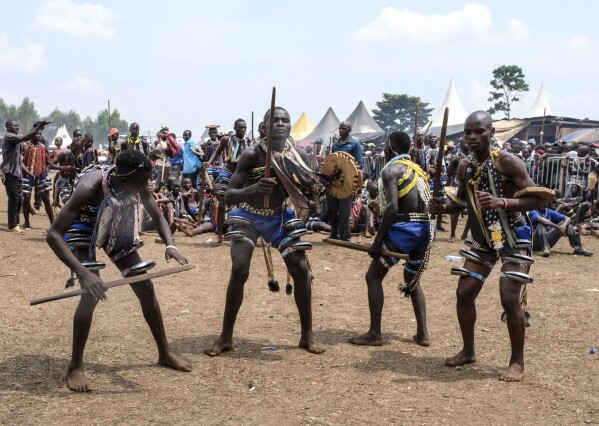 Young boys perform prior to the launch of the circumcision season, known as Imbalu, at Kamu Village in Mbale, Eastern Uganda, Saturday, Aug. 3, 2024. (AP Photo/Hajarah Nalwadda)