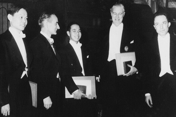 From left, Dr. Chen Ning Yang of Princeton University; Prof Daniel Bovet of Rome, who received prize in medicine for work in the field of pharmacology; Dr. Tsung Dao Lee, of Columbia University, who shares the physics prize with Chen for disproving the law of parity, long considered a fundamental law of nature; Sir Alexander Todd of Cambridge University, England, cited for his work in chemistry; and Albert Camus, of France, who received the prize in literature, are shown after receiving their awards in Stockholm, Sweden, Dec. 10, 1957. Chinese-American physicist Tsung-Dao Lee, who in 1957 became the second youngest scientist ever to receive a Nobel Prize, died Sunday, Aug 4, 2024 at his home in San Francisco at the age of 97, according to a Chinese university and a research center. (AP Photo)