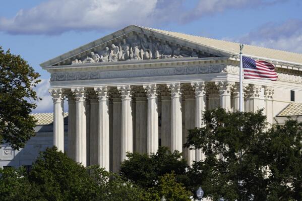 In this Oct. 18, 2021 photo, the Supreme Court is seen in Washington. Texas is urging the Supreme Court to leave in place its law banning most abortions and telling the justices there’s no reason to rush into the case. The state filed its response Thursday to the Biden administration’s call on the high court to block the law and rule conclusively this term on the measure’s constitutionality.  (AP Photo/J. Scott Applewhite)