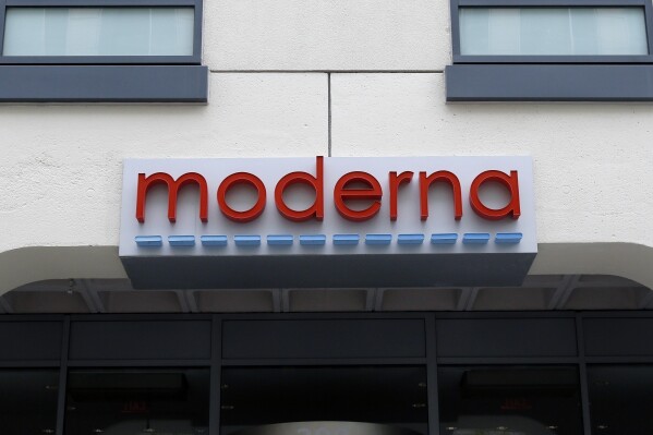 FILE - A sign marks an entrance to a Moderna building in Cambridge, Mass., on May 18, 2020. (AP Photo/Bill Sikes, File)