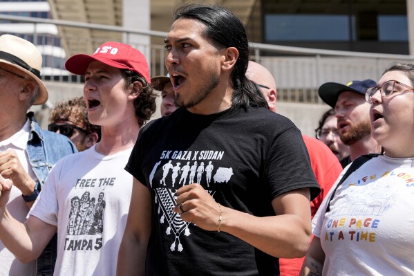 Members of the Coalition to March on the RNC speak during a news conference ahead of the 2024 Republican National Convention, Sunday, July 14, 2024, in Milwaukee. (AP Photo/Alex Brandon)