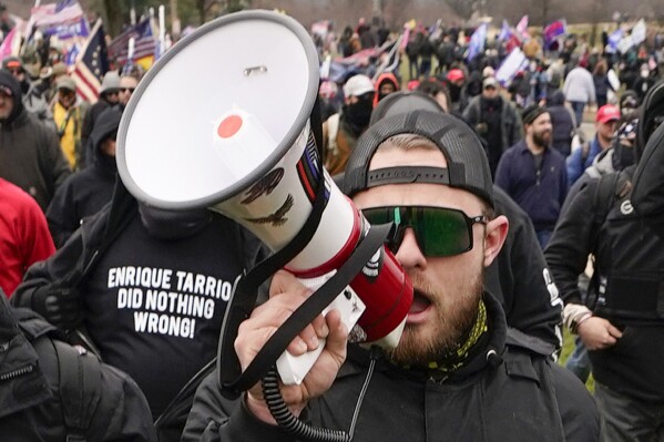 FILE - Proud Boy member Ethan Nordean walks toward the U.S. Capitol in Washington, in support of President Donald Trump on Jan. 6, 2021. (AP Photo/Carolyn Kaster, File)