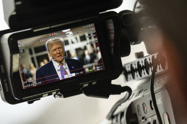 Former President Donald Trump, seen through a camera viewfinder, speaks to members of the media at Manhattan criminal court in New York, on May 2, 2024. (Jeenah Moon/Pool Photo via AP)