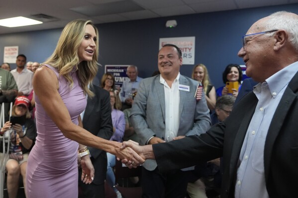 Republican National Committee co-chair Lara Trump arrives and greets Michigan Republican Party Chairman Pete Hoekstra to kickoff an election integrity volunteer training at the Oakland County GOP Headquarters, Friday, June 14, 2024 in Bloomfield Hills, Mich. (AP Photo/Carlos Osorio)