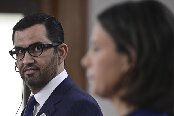 The Minister of Industry and Advanced Technology in the United Arab Emirates (UAE) and COP28 UAE President-Designate, Sultan Ahmed al-Jaber, left, and German Foreign Minister Annalena Baerbock, right, address the media during a joint press conference on the second day of the Petersberg Climate Dialogue in Berlin, Germany, Wednesday, May 3, 2023. (John MacDougall/Pool Photo via AP)