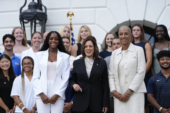 Vice President Kamala Harris stands for a photo with Jordynn Dudley, Florida State University women's soccer player, center left, and NCAA Vice President Lynda Tealer, right, and other NCAA college athletes, after speaking from the South Lawn of the White House in Washington, Monday, July 22, 2024, during an event with the athletes. This is her first public appearance since President Joe Biden endorsed her to be the next presidential nominee of the Democratic Party. (AP Photo/Susan Walsh)