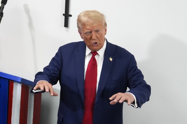 Republican presidential nominee former President Donald Trump speaks during a stop at a campaign office, Monday, Aug. 26, 2024, in Roseville, Mich. (AP Photo/Carolyn Kaster)