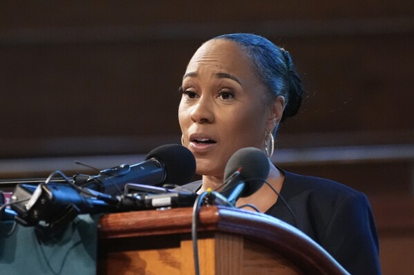 FILE - Fulton County district attorney Fani Willis speaks at Turner Chapel AME church Thursday, June 13, 2024, in Marietta, Ga. A Georgia appeals court has set a December hearing for arguments on the appeal of a lower court ruling allowing Fulton County District Attorney Fani Willis to continue to prosecute the election interference case she brought against former President Donald Trump. (AP Photo/John Bazemore, File)