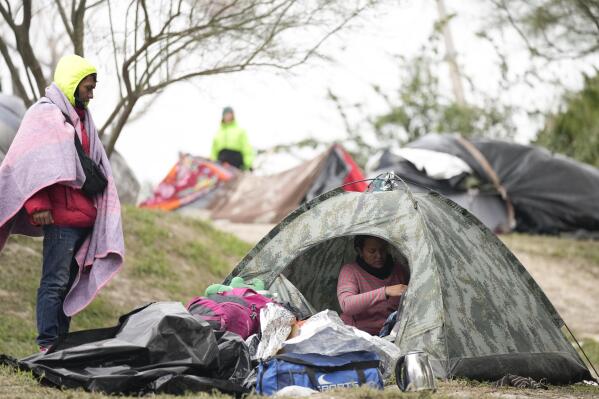 FILE - Migrants from Venezuela prepare for relocation to a refugee shelter in Matamoros, Mexico, Dec. 23, 2022. The Supreme Court is keeping pandemic-era limits on people seeking asylum in place indefinitely, dashing hopes of immigration advocates who had been anticipating their end this week. The restrictions, often referred to as Title 42, were put in place under then-President Donald Trump at the beginning of the pandemic to curb the spread of COVID-19. (AP Photo/Fernando Llano, File)