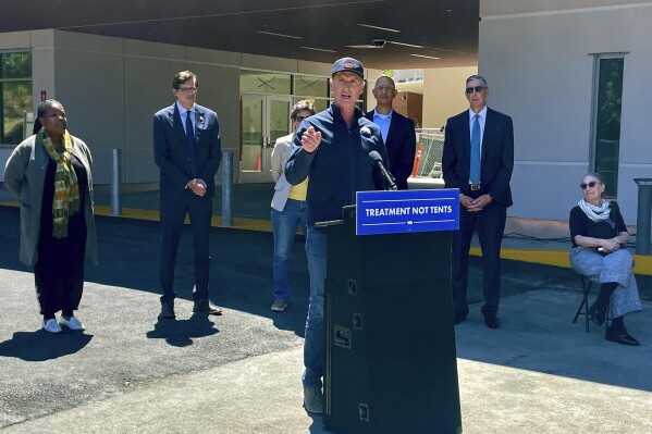 California Gov. Gavin Newsom makes an announcement on Tuesday, May 14, 2024, in San Mateo, Calif. Hammered by mounting pressure to address the growing homelessness crisis in California, Newsom announced that his administration will make $3.3 billion available ahead of schedule for counties and private developers to start building more behavioral health treatment centers as part of his efforts to fund housing and drug use programs. (AP Photo/Haven Daley)