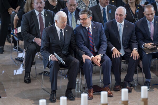 President Joe Biden, left, greets Speaker of the House Mike Johnson, R-La., joined by House Majority Leader Steve Scalise, R-La., and House Minority Leader Hakeem Jeffries, D-N.Y., as they honor the memory of the 6 million Jews killed in the Holocaust during the annual Days of Remembrance ceremony at the Capitol in Washington, Tuesday, May 7, 2024. (AP Photo/J. Scott Applewhite)