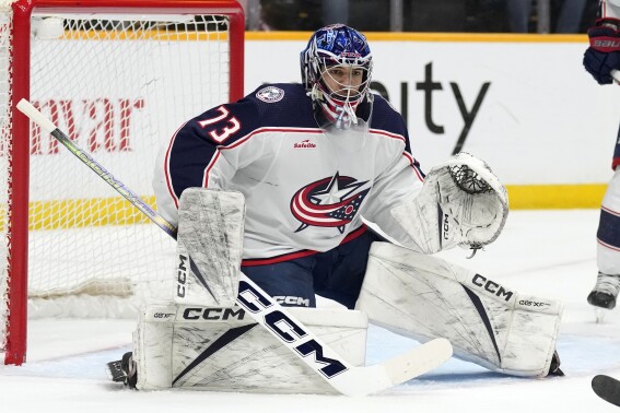 FILE - Columbus Blue Jackets goaltender Jet Greaves (73) plays against the Nashville Predators during the second period of an NHL hockey game Saturday, April 13, 2024, in Nashville, Tenn. The Blue Jackets signed the 23-year-old goalie to a new two-year contract. (AP Photo/Mark Humphrey, File)