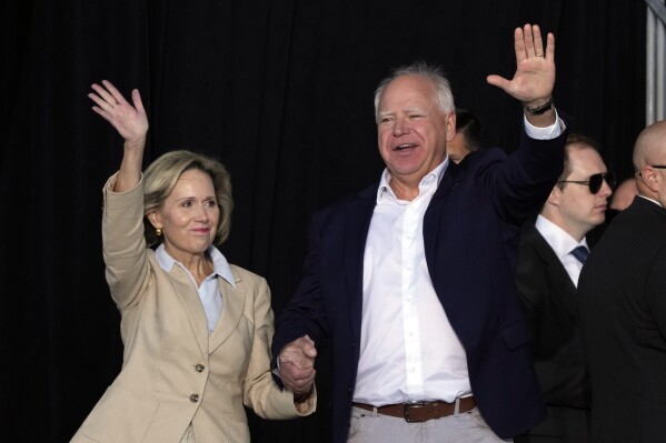 Democratic vice presidential nominee Minnesota Gov. Tim Walz and his wife Gwen arrive for a campaign stop at Laborfest Monday, Sept. 2, 2024, in Milwaukee. (AP Photo/Morry Gash)