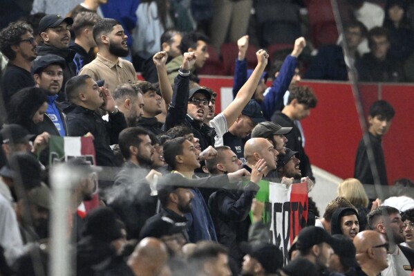 Italy's fans cheer their team during the UEFA Nations League soccer match between Israel and Italy, at Bozsik Arena, in Budapest, Hungary, Monday, Sept. 9, 2024. (AP Photo/Denes Erdos)