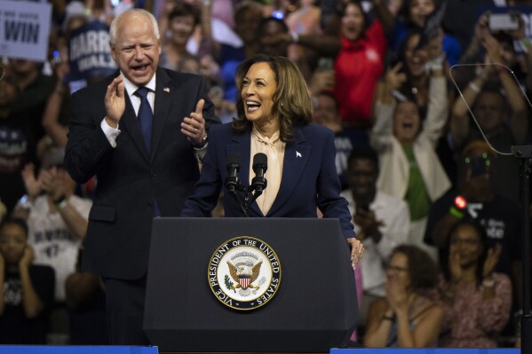 Democratic presidential nominee Vice President Kamala Harris and her running mate Minnesota Gov. Tim Walz speak at a campaign rally in Philadelphia, Tuesday, Aug. 6, 2024. (AP Photo/Joe Lamberti)