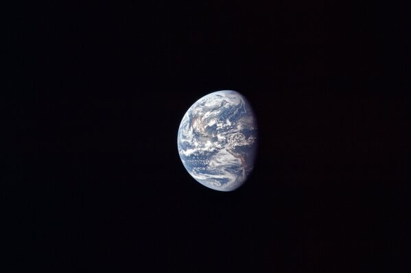 This July 17, 1969 photo made available by NASA shows the Earth as the Apollo 11 mission travels towards the moon. It’s estimated that about 600 million people around the world watched as Neil Armstrong and Buzz Aldrin landed on the moon in 1969. (NASA via AP)