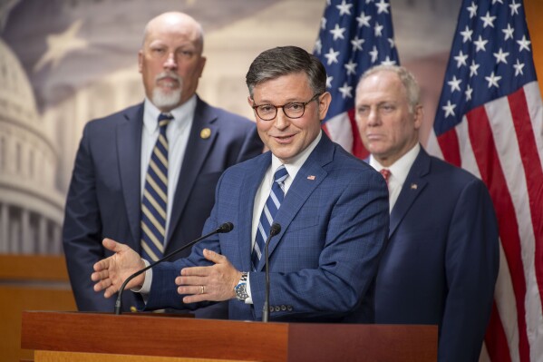 Speaker of the House Mike Johnson, R-La., speaks at a news conference with Rep. Chip Roy, R-Texas, left, House Majority Leader Steve Scalise, R-La., right, at the Capitol on Tuesday, July 9, 2024 in Washington. (AP Photo/Kevin Wolf)