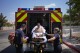FILE - Members of the Henderson Fire Department load Deb Billet, 66, into an ambulance before transporting her to the hospital for heat-related symptoms, Wednesday, July 10, 2024, in Henderson, Nev. Heat is the top cause of weather-related fatalities nationwide. But because investigations of suspected heat deaths can take months, and mishmash of methods counties use to count them, we really don't know exactly how many people died in the most recent heat wave stretching back to July 1. (AP Photo/John Locher, File)
