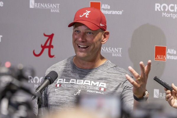 Alabama head coach Kalen DeBoer talks with the media following NCAA college football practice, Wednesday, July 31, 2024, in Tuscaloosa, Ala. (AP Photo/Vasha Hunt)