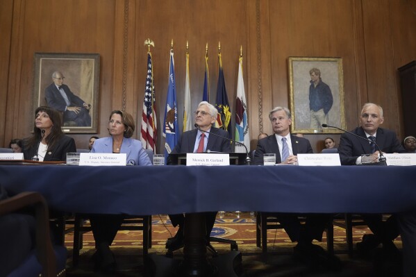 Attorney General Merrick Garland, center, speaks before a meeting of the Justice Department's Election Threats Task Force, at the Department of Justice, Wednesday, Sept. 4, 2024, in Washington, with from left, Deputy Attorney General, Criminal Division, Nicole Argentieri, Deputy Attorney General Lisa Monaco, Garland, FBI Director Christopher Wray and Assistant Attorney General, National Security Division, Matthew Olsen. (AP Photo/Mark Schiefelbein)