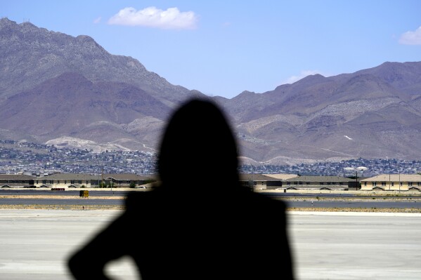 FILE - Vice President Kamala Harris stands in front of mountains during a news conference, June 25, 2021, at the airport after her tour of the U.S. Customs and Border Protection Central Processing Center in El Paso, Texas. (AP Photo/Jacquelyn Martin, File)