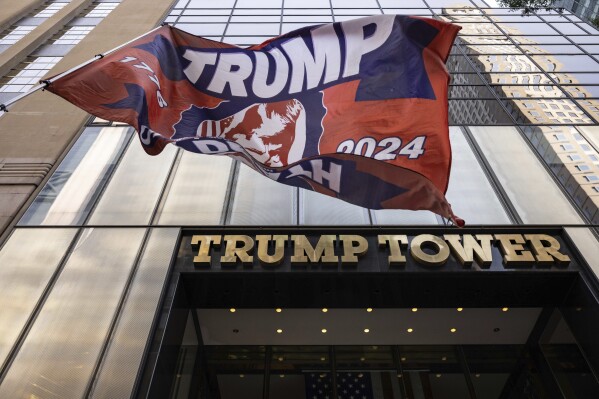 Trump 2024 flag is raised outside of Trump Tower, Sunday, July 14, 2024, in New York. (AP Photo/Yuki Iwamura)