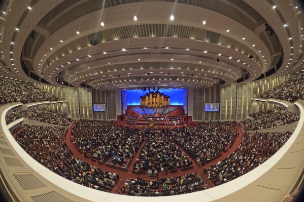 FILE - This image made with a fisheye lens shows people attending the twice-annual conference of the Church of Jesus Christ of Latter-day Saints, on April 7, 2024, in Salt Lake City. (AP Photo/Rick Bowmer, File)