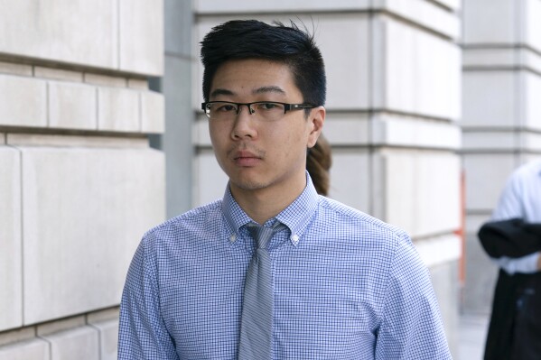 Montgomery County police officer Justin Lee arrives to the U.S. Federal Courthouse in Washington, Friday, Aug. 23, 2024. (AP Photo/Jose Luis Magana)