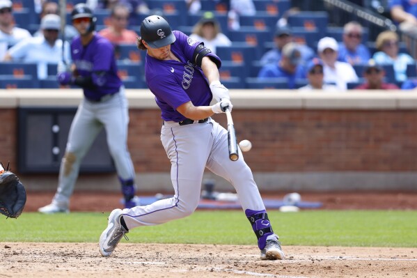 Colorado Rockies' Michael Toglia (4) hits a home run against the New York Mets during the sixth inning of a baseball game, Sunday, July 14, 2024, in New York. (AP Photo/Noah K. Murray)