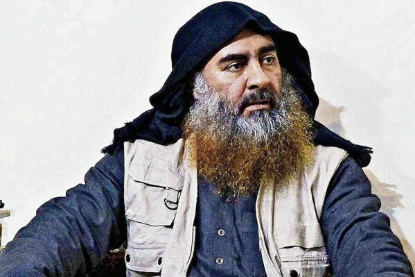 FILE - This file image released by the Department of Defense on Wednesday, Oct. 30, 2019, and displayed at a Pentagon briefing, shows an image of Islamic State leader Abu Bakr al-Baghdadi. An Iraqi court issued a death sentence Wednesday, July 10, 2024 against one of the wives of the late brutal Islamic State leader Abu Bakr al-Baghdadi, alleging that she was complicit in crimes committed against Yazidi women captured by the militant group. (Department of Defense via AP, File)