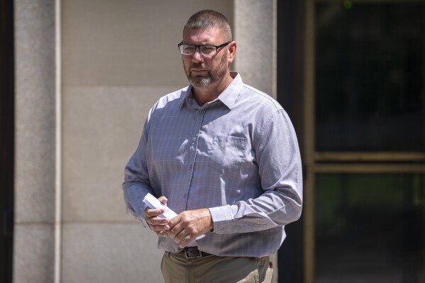 Michael Sparks, the first rioter to enter the Capitol on Jan. 6, 2021, leaves federal court on Tuesday, Aug. 27, 2024, in Washington. (AP Photo/Mark Schiefelbein)