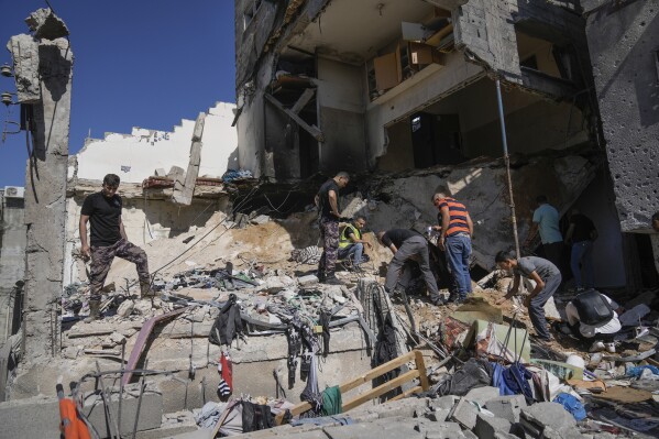 Palestinians inspect the destruction following an Israeli operation in Nur Shams refugee camp, near the West Bank town of Tulkarem, Sunday, June 30, 2024. Palestinian health officials said one person was killed and several wounded during an Israeli operation in the Nur Shams refugee camp in the northern West Bank. Israel frequently operates in the area, saying it is a stronghold of Palestinian militants. (AP Photo/Majdi Mohammed)