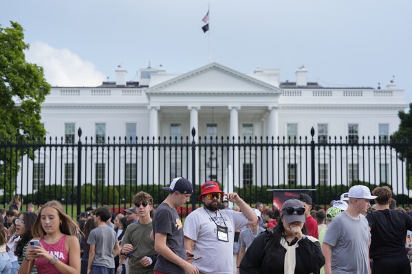 People stop outside the White House in Washington on Thursday, May 30, 2024. Former President Donald Trump became the first former president to be convicted of felony crimes as a New York jury found him guilty of 34 felony counts of falsifying business records in a scheme to illegally influence the 2016 election through hush money payments to a porn actor who said the two had sex. (AP Photo/Pablo Martinez Monsivais)