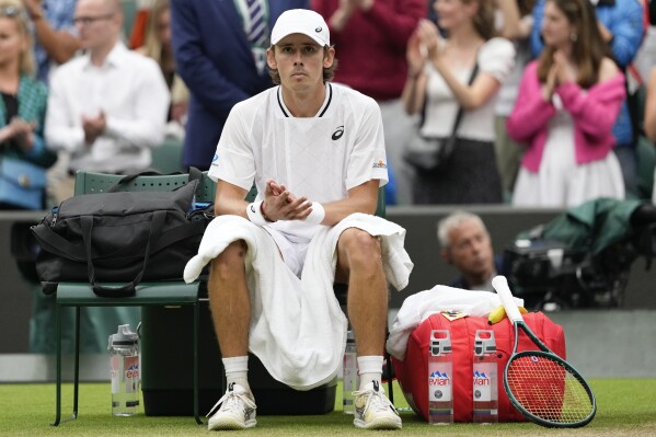 Alex de Minaur of Australia reacts following his fourth round win over Arthur Fils of France at the Wimbledon tennis championships in London, Monday, July 8, 2024. (AP Photo/Alberto Pezzali)