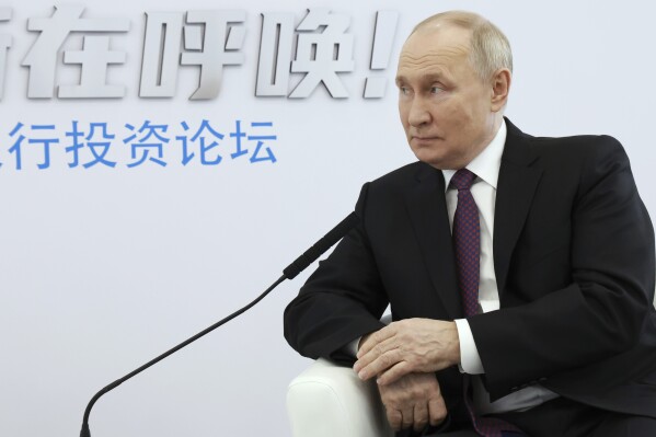 Russian President Vladimir Putin listens to Oman's Crown Prince Theyazin bin Haitham during their talks on the sidelines of the annual VTB Capital "Russia Calling!" Investment Forum in Moscow, Russia, Thursday, Dec. 7, 2023. (Vyacheslav Prokofyev, Sputnik, Kremlin Pool Photo via AP)