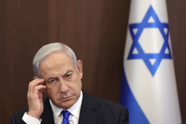 FILE - Israeli Prime Minister Benjamin Netanyahu attends the weekly cabinet meeting in the prime minister's office in Jerusalem, June 25, 2023. Prime Minister Benjamin Netanyahu’s office says the Israeli leader will undergo surgery on Sunday for a hernia. (Abir Sultan/Pool Photo via AP, File)