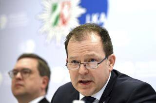 Dirk Kunze, right, Head of Department 42 at the North Rhine-Westphalia State Criminal Police Office, and Markus Hartmann, Head of the North Rhine-Westphalia Cybercrime Central and Contact Point, answer questions during a press conference in Duesseldorf, Germany, Monday, March 6, 2023. German police said Monday that they have worked with law enforcement partners, including Europol, the U.S. Federal Bureau of Investigation and authorities in Ukraine, to dismantle an international cybercrime gang that has been extorting large companies and institutions for years. (Federico Gambarini/dpa via AP)